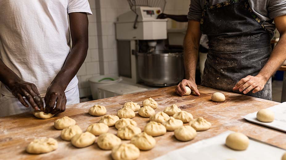 Group of people group of colleagues working in a bakery factory
